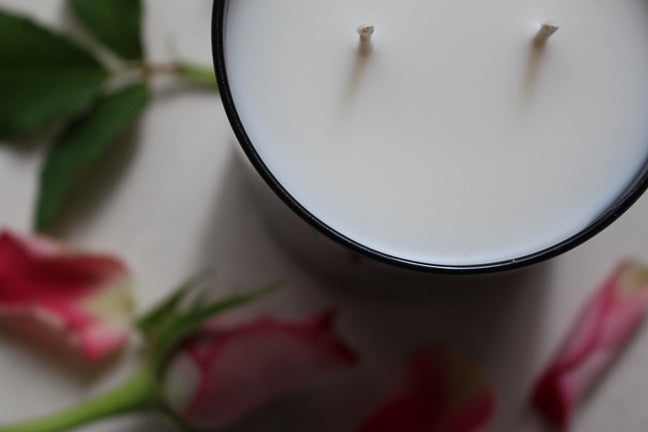 Close up of Love Letter Candle, styled.