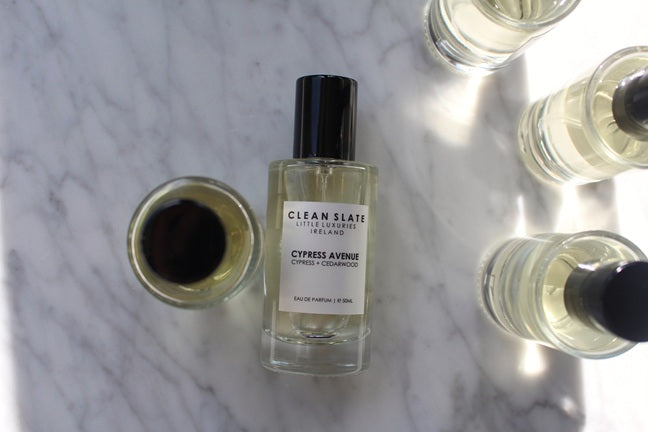 Close-up of Cypress Avenue Eau De Parfum 50ML with other perfumes.
