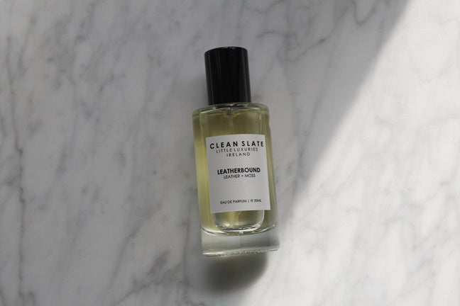 Close-up of Leatherbound Eau De Parfum 50ML bottle on marble.