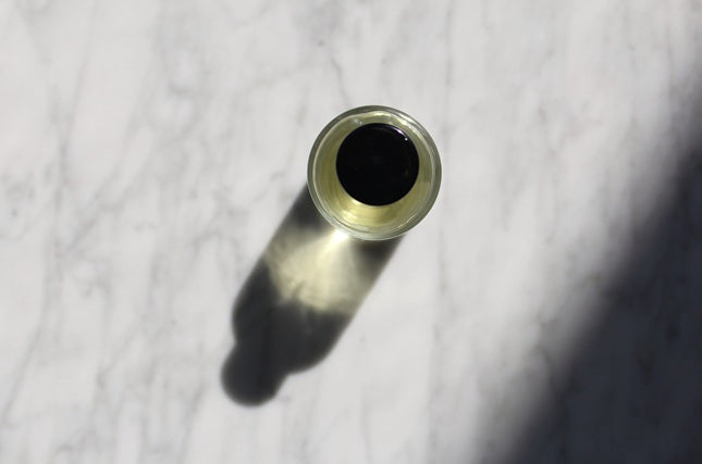 Myrrh Melody Eau De Parfum 50ML bottle arial shot of bottle top on marble.