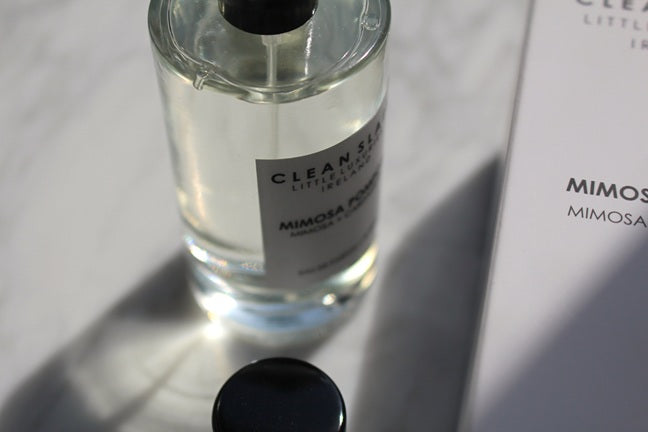 Close-up of Mimosa Pompom Eau De Parfum 50ML bottle with box.